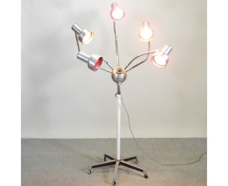 An unusual 1960's aluminium and chrome adjustable salon heat lamp, on castors, converted to a standard lamp, 178cm high 