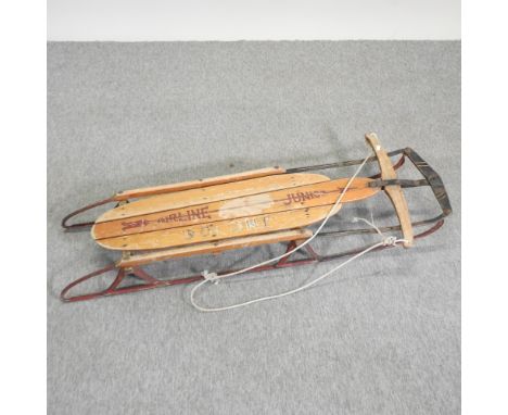 An early 20th century wooden sledge, 127cm long