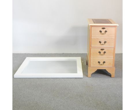 A light oak veneered narrow chest, 41cm, together with a white painted wooden wall mirror (2)