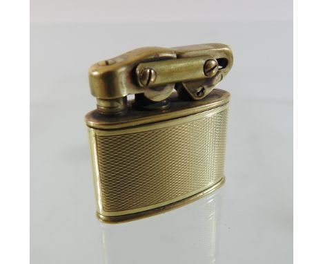 An early 20th century 14 carat gold cased German pocket lighter, with engine turned decoration, by Karl Weiden, 4cm high