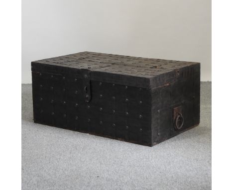 An Indian iron bound trunk/coffee table, with a hinged lid, 103cm