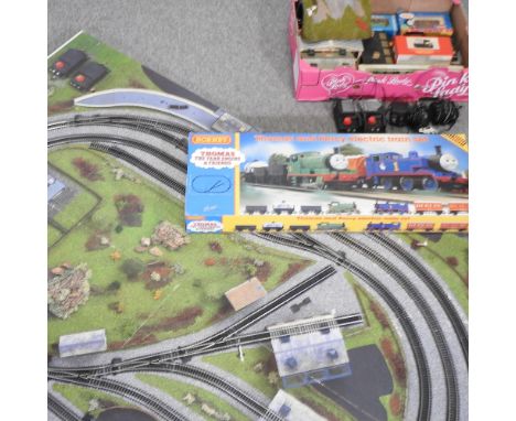 A Hornby model railway board layout, 183 x 122cm, together with Thomas the Tank Engine and Percy set and other railway access