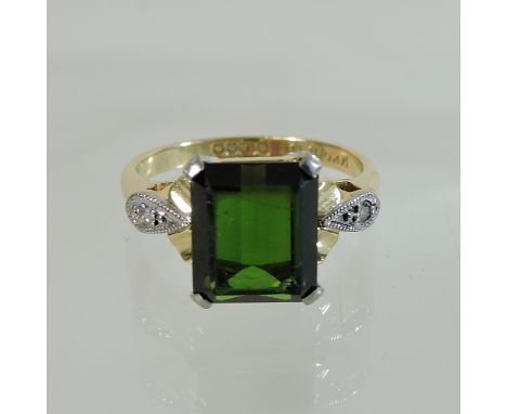 An 18 carat gold diopside and diamond ring, boxed