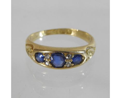 An 18 carat gold, sapphire and diamond five stone ring, with valuation