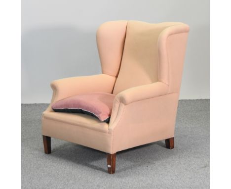 A 19th century wing back armchair, with a loose cover, together with an oak gate leg table, 32 x 115cm