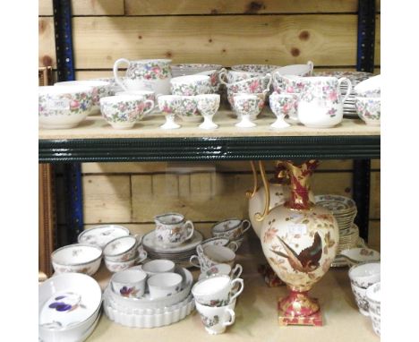 Two shelves of Crown Staffordshire teawares, together with Worcester Evesham and other china