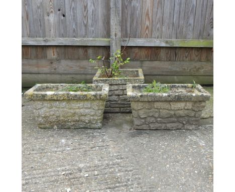 A pair of rectangular stone planters, 52cm, together with another planter