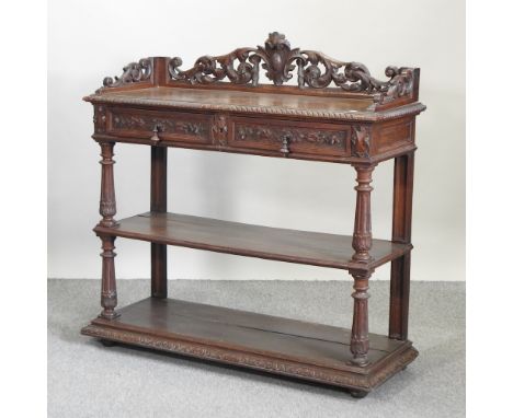 A Victorian carved oak three tier buffet, 120cm