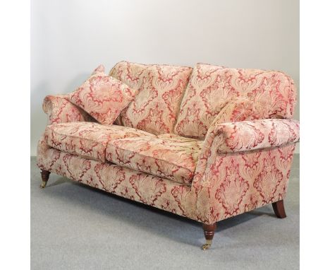 A modern Parker Knoll red and gold upholstered two seater sofa, 180cm