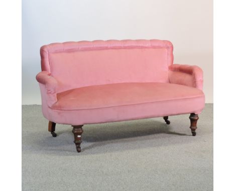 A Victorian pink upholstered sofa, on turned legs, 136cm