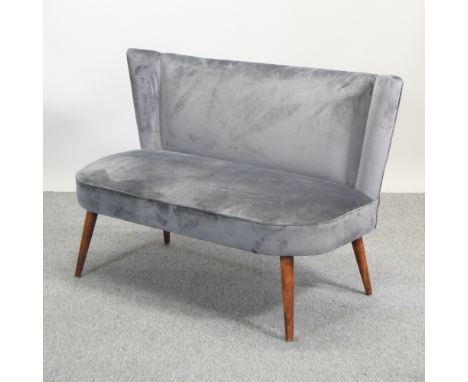 A 1960's style grey upholstered cocktail sofa, on tapered legs, 126cm