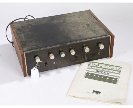 Sansui AU-101 solid-state stereo amplifier, together with original instruction manual.