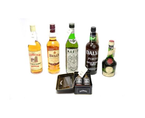 A selection of bottles of alcohol, including: a Martini Vermouth, 75cl, 17%; a Bell’s Eight Years Old Finest Old Scotch Whisk