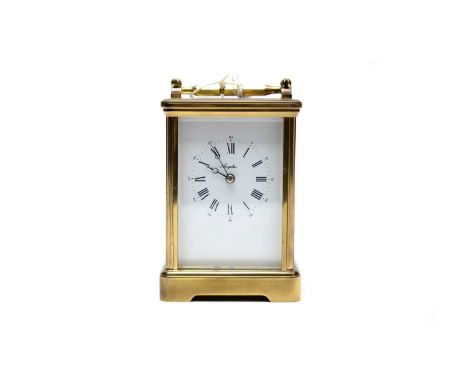 A 20th Century Angelus brass cased carriage clock, the white dial with Roman numerals in black, platform lever escapement, 17