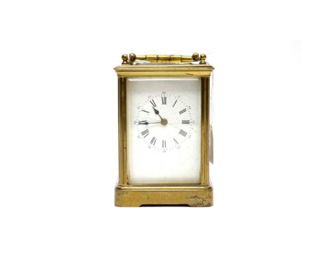 A 19th Century brass cased carriage clock, the white dial with Roman numerals in black, platform lever escapement, 17cms high