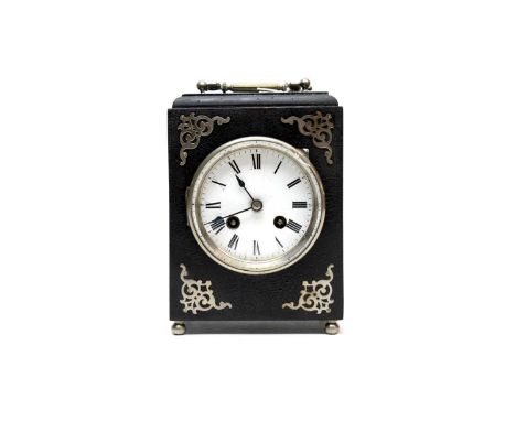 A German mantel clock, retailed by Friedrich of Worcester, white enamel Roman dial, with ebonised case, raised on four ball f