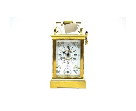 A 20th Century brass cased carriage clock, the white Roman dial with printed floral decoration, subsidiary Arabic alarm dial,