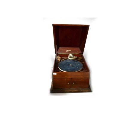 A Dulcetto mahogany cased symphonium or gramophone, the hinged top opening to reveal record player within, over a pair of hin