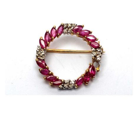 A diamond and ruby circlet brooch, in 9ct white and yellow gold mount, 2.2cms wide, 2.9g gross.