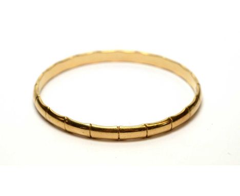 A 9ct yellow gold bamboo pattern bangle, 25.4g gross. 