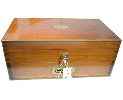 A late 19th/ early 20th Century mahogany games box, the hinged lid opening to reveal open compartments containing games piece