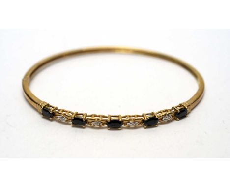 A sapphire and diamond bangle, in 9ct yellow gold mount, 7.0g gross.