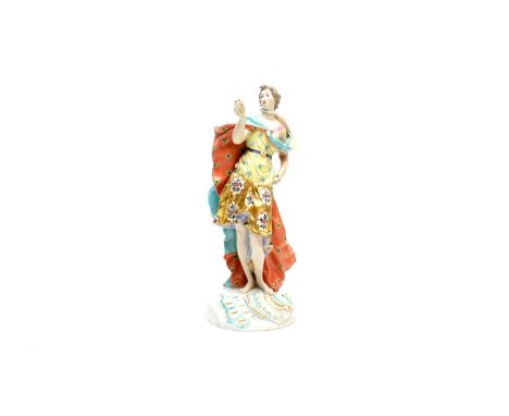 A 19th Century Continental ceramic figure of a lady, modelled in a flowing cloak, 28cms high.