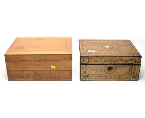 An Edwardian marquetry and mother of pearl inlaid walnut writing slope, the hinged lid opening to reveal writing surface with