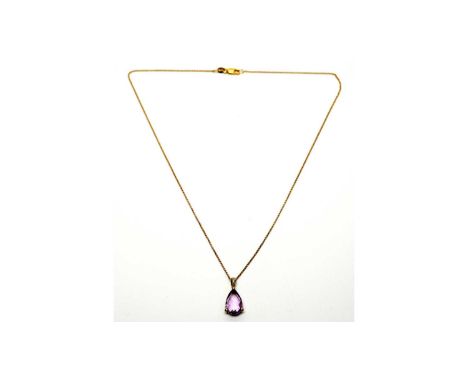 An amethyst and diamond pendant, the fancy pear-cut amethyst set below brilliant cut diamond bale in 9ct yellow gold mount, o