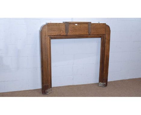 An Art Deco ‘Beadnell’ oak fire surround by Atom Mantels, with labels to reverse 135 x 15 x 131cms high, internal measurement