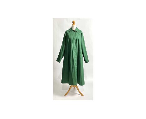 A vintage Burberrys' or Burberry classic Camden-type car coat in emerald green, lined in a blue and green check, (loose-fit),