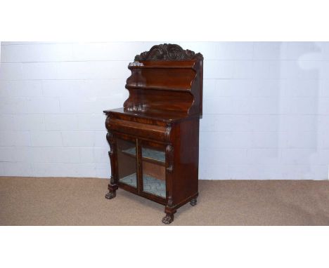 A well carved Victorian mahogany chiffonier, the shelved superstructure with ornate carved acanthus leaf and scroll pattern f