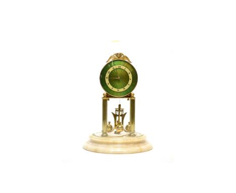 A 20th Century German brass enamelled anniversary clock, the circular green enamelled Arabic dial with cherub finial, raised 