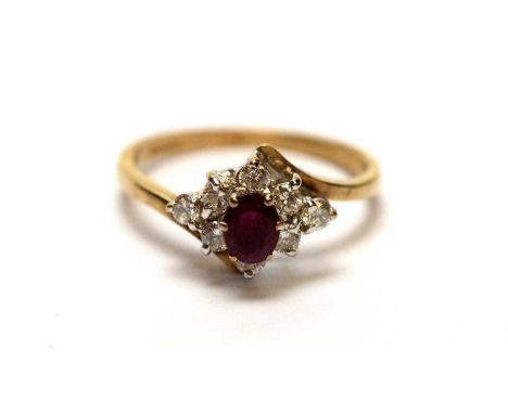 A ruby and diamond ring, the oval facet cut ruby (probably synthetic) surrounded by eight brilliant cut diamonds, on 9ct yell