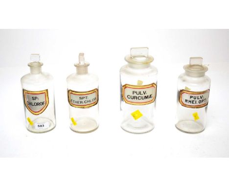 A set of four apothecary bottles and stoppers, each with enamel label, including: ‘Pulv: Curcumae’; ‘Spt Aether: Chlor’; and 