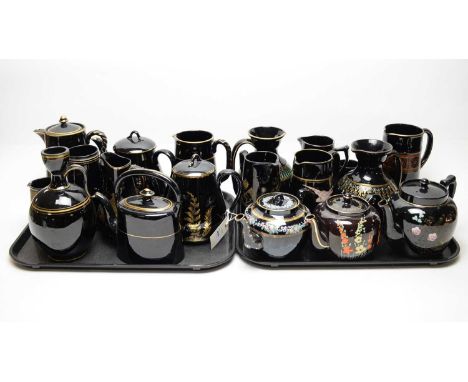 A collection of Ridgway Jetware, including: three teapots, one inscribed 'World War II, escorted to the USA by the Royal Navy