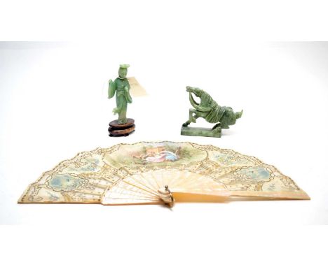 A Continental hand fan, with mother of pearl handle, signed Jolivet; together with a Chinese carved jade style figure of a de