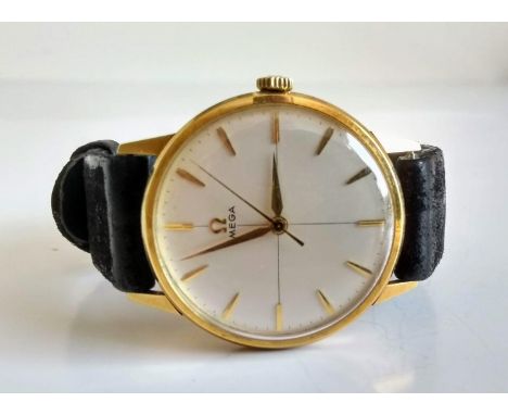 A gents 14ct yellow gold Omega manual-wind watch, oyster coloured dial, 33mm, baton markings on conforming leather strap, Swi