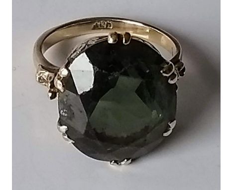 An Edwardian gold and green opal (15mm x 13mm) dress ring in a claw setting, size K, stamped 9ct, 5.35g 