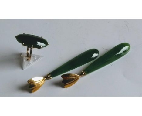 An elliptical jade ring, size M1/2 and matching drop earrings with yellow gold clips, stamped 9ct 