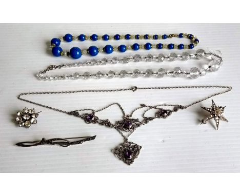 A Victorian faceted crystal necklace, a lapis lazuli and crystal graduated bead necklace, Victorian star brooch, Art Nouveau 