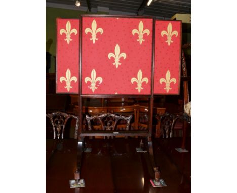 A mahogany firescreen on splayed legs 