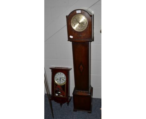 A small chiming longcase clock and a modern striking wall clock (2) 