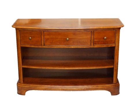 'WILLIS & GAMBIER' CHERRY WOOD BOW FRONT SIDE CABINETwith a moulded top above three frieze drawers with two open shelves belo