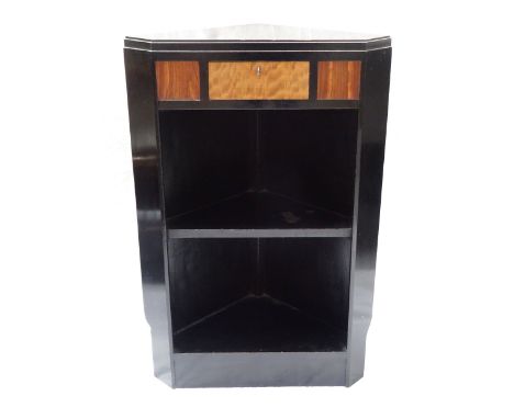 EBONISED CORNER CABINETthe single drawer with satinwood veneer facing, above open compartments with shelf, with key, 80cm hig