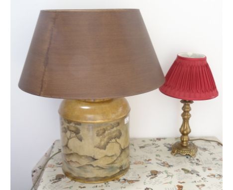 PAINTED TEA CADDY STYLE LAMPdecorated with houses amongst hills, with a brown shade, 64cm high; and a shaped brass lamp with 
