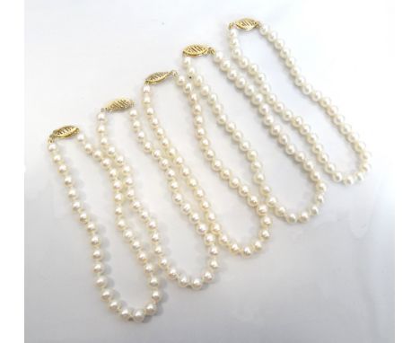 FIVE CULTURED PEARL BRACELETSall will pierced nine carat gold clasps (5)