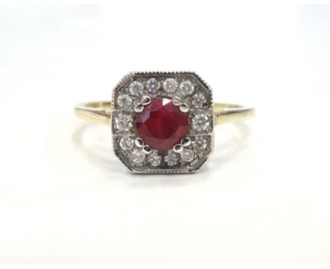 RUBY AND DIAMOND CLUSTER RINGthe central ruby approximately 0.5cts in fourteen diamond surround, on nine carat gold shank, ri