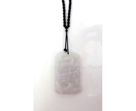 CARVED LIGHT PURPLE JADE PENDANTcarved with a dragon to one side and stylised bird to the other, approximately 4.9cm high