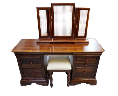 'WILLIS & GAMBIER' HEVEA KNEEHOLE DRESSING TABLEwith an arrangement of seven drawers, standing on bracket feet, 149cm wide, a